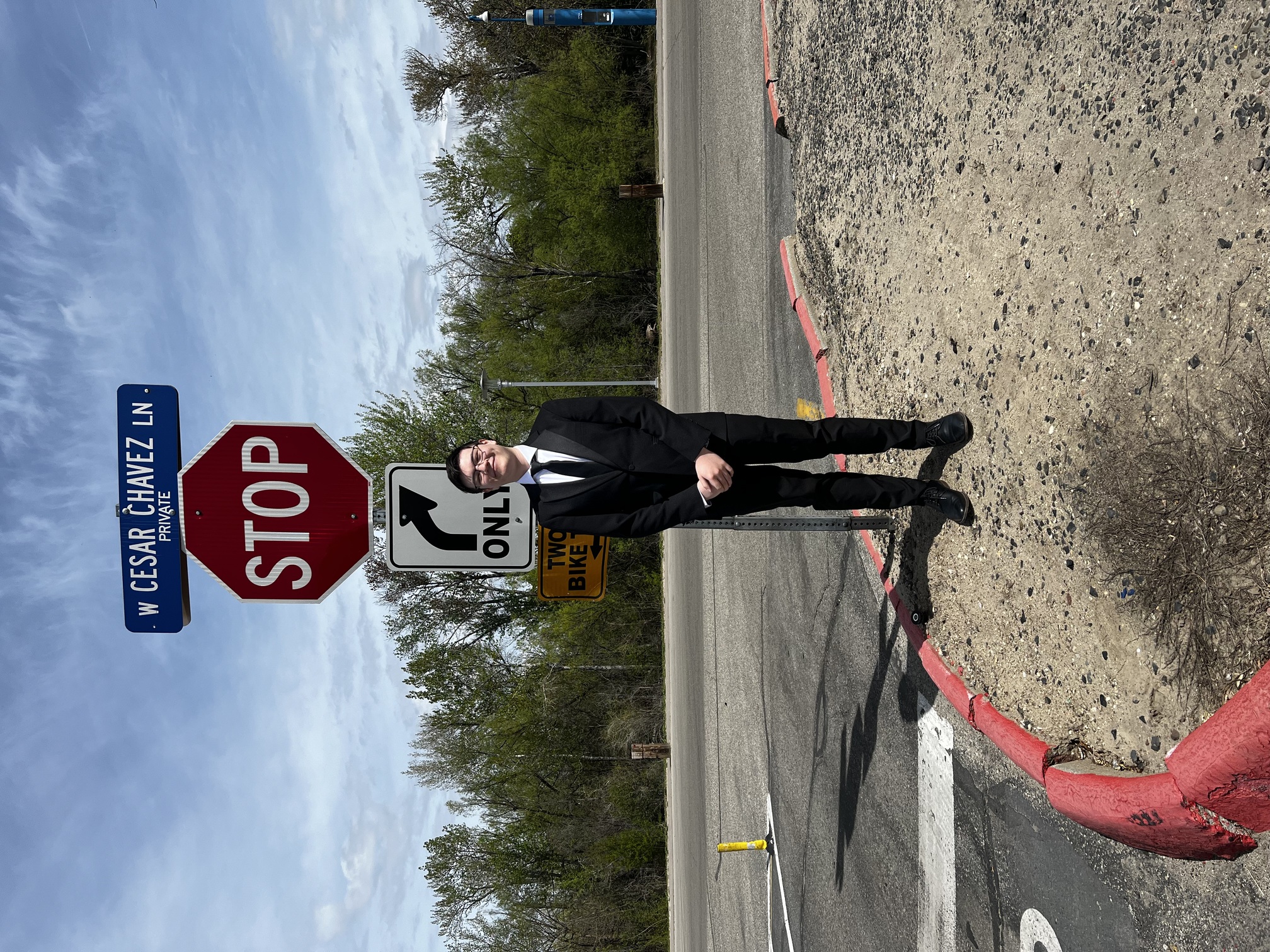 Picture of me standing next to a stop sign