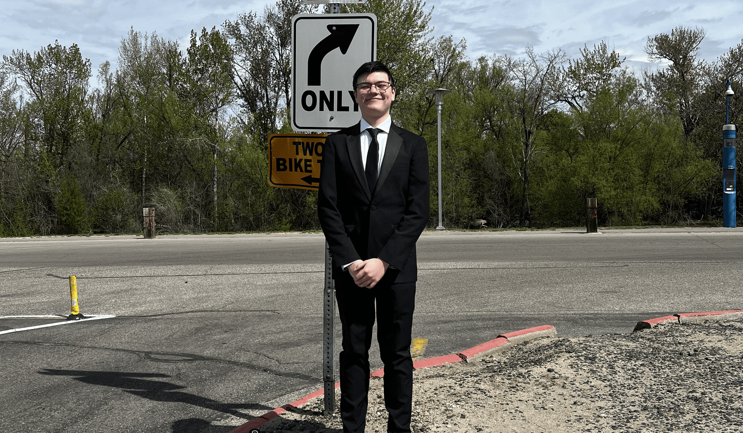 Picture of me standing next to a stop sign